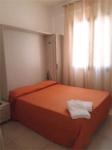 A bed or beds in a room at L'Isola del Sale Még 37 kép