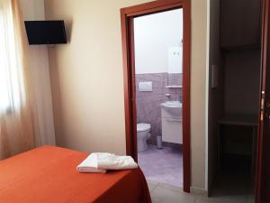 A bed or beds in a room at L'Isola del Sale