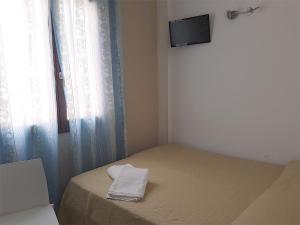 A bed or beds in a room at L'Isola del Sale