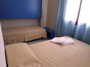 A bed or beds in a room at L'Isola del Sale