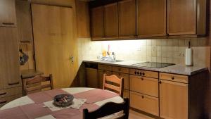 a kitchen with a table with a skull on it at Chalet Spillstatt in Grindelwald