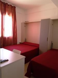 A bed or beds in a room at L'Isola del Sale