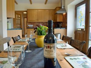 a bottle of wine sitting on top of a table at Ty Nant in Llanon