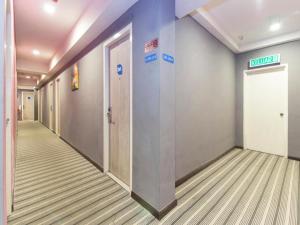 a hallway of an office building with a elevator at i-Hotel @ Johor Bahru in Kampong Telok Serdang