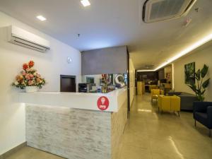 a lobby of a hospital with a reception counter at OYO 264 City Edge Hotel in Kuala Lumpur
