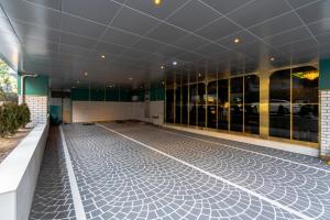 an empty building with ailed floor and windows at Hotel Ippda Wonju in Wonju
