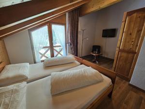 Postel nebo postele na pokoji v ubytování Lärchen Lodge