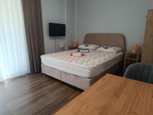 Postel nebo postele na pokoji v ubytování Mihenk Pansiyon