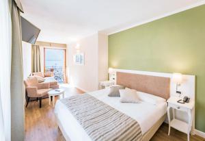Voodi või voodid majutusasutuse Hotel Garni Corona toas