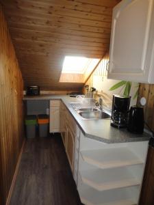 Kuchyň nebo kuchyňský kout v ubytování Gästehaus am Sonnenberg