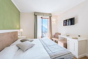 Voodi või voodid majutusasutuse Hotel Garni Corona toas