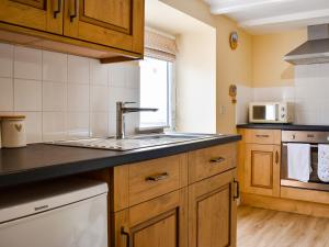 Kuchyň nebo kuchyňský kout v ubytování Sea Breeze Cottage