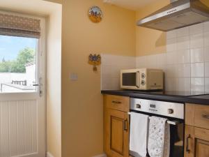 Kuchyň nebo kuchyňský kout v ubytování Sea Breeze Cottage