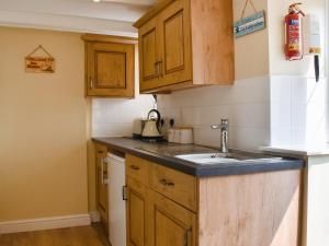 Kuchyň nebo kuchyňský kout v ubytování Sea Breeze Cottage + 6 fotografií