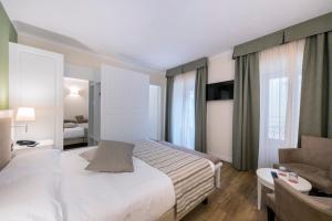 Voodi või voodid majutusasutuse Hotel Garni Corona toas