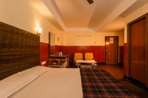 Postel nebo postele na pokoji v ubytování Hotel Srilakshmi