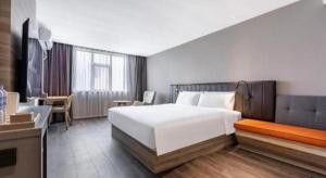 Postel nebo postele na pokoji v ubytování Hanting Hotel Shanghai Jinqiao International Square