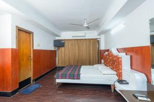 Postel nebo postele na pokoji v ubytování Hotel Srilakshmi