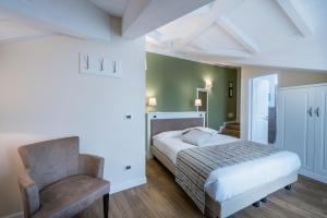 Voodi või voodid majutusasutuse Hotel Garni Corona toas
