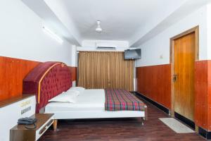 Postel nebo postele na pokoji v ubytování Hotel Srilakshmi