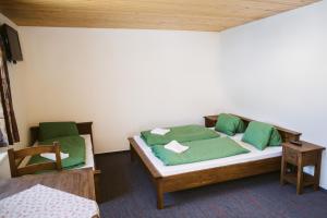 Säng eller sängar i ett rum på Apartmány Zuzka