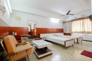 Postel nebo postele na pokoji v ubytování Hotel Srilakshmi