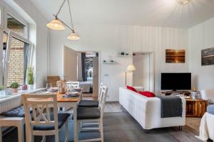 TV a/nebo společenská místnost v ubytování Feel Meer