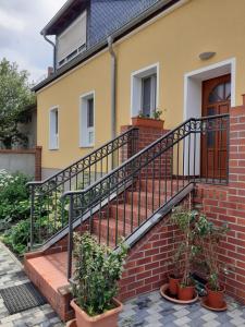 a set of stairs in front of a house at Ferienwohnungen Kusche in Stennewitz
