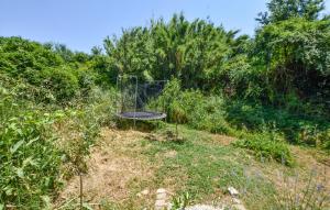 a metal object in the middle of a field at Maison Avec Jacuzzi in Mazan +9 photos