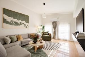 a living room with a couch and a table at The Brass Bear in Darlinghurst in Sydney
