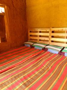 Postel nebo postele na pokoji v ubytování Hideout Rawana Meenure