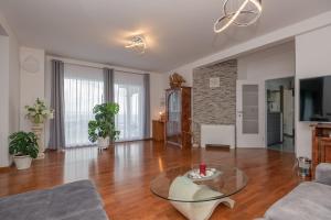 a living room with a glass table and a couch at Villa Miramel mit privaten Swimmingoool - Makarska Exklusiv in Makarska