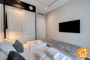Posteľ alebo postele v izbe v ubytovaní Apartamenty Baltic Fort - visitopl