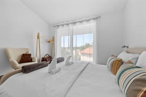 Postel nebo postele na pokoji v ubytování Apartmani Paliska + 37 fotografií