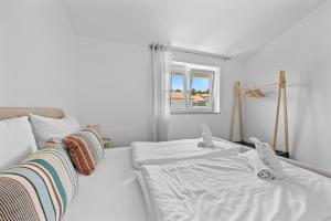 Postel nebo postele na pokoji v ubytování Apartmani Paliska