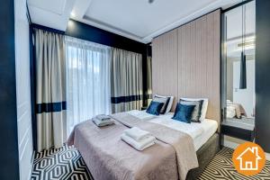Posteľ alebo postele v izbe v ubytovaní Apartamenty Baltic Fort - visitopl