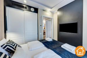 Posteľ alebo postele v izbe v ubytovaní Apartamenty Baltic Fort - visitopl