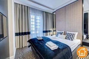 Posteľ alebo postele v izbe v ubytovaní Apartamenty Baltic Fort - visitopl
