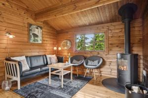 Posezení v ubytování Cozy Cottage For Fun And Relaxation