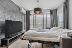 En eller flere senge i et værelse på LAM Felidae - AC - Balcony