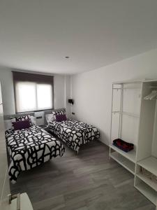 A bed or beds in a room at Edificio Resort Gran8Nerja