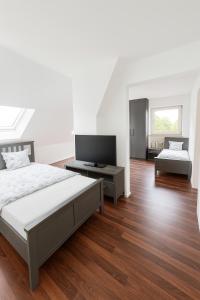Ένα ή περισσότερα κρεβάτια σε δωμάτιο στο MODERN, VOLLAUSGESTATTET, GROßER PARKPLATZ, 6 ZIMMER