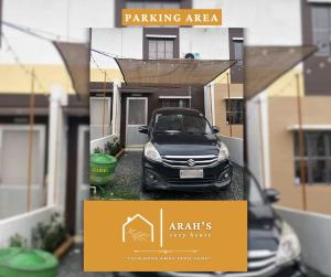 a picture of a car parked in front of a house at Arah Cozy House in Dasmariñas