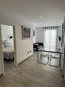 A bed or beds in a room at Edificio Resort Gran8Nerja