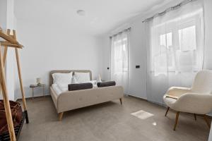 Postel nebo postele na pokoji v ubytování Apartmani Paliska