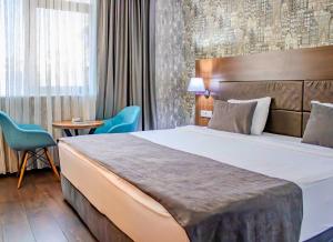 Postel nebo postele na pokoji v ubytování Ma City Hotel + 30 fotografií