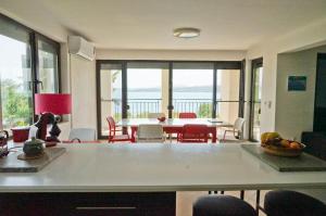 a kitchen and dining room with a table and chairs at Six bedroom luxury villa with private pool in quiet residential area near beaches in Sozopol +37 photos
