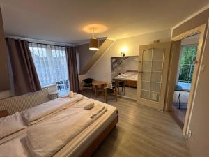Postel nebo postele na pokoji v ubytování Veno- Niechorze