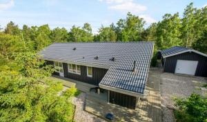 an overhead view of a house with a deck at Holiday Home Near Mini-Mallorca In Øster Hurup in Hadsund