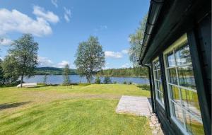 a window of a house with a view of a lake at 2 Bedroom Awesome Home In Östmark in Östmark